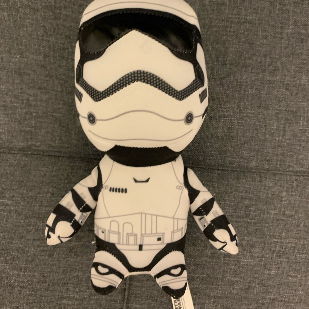 Star Wars Storm Trooper white plushie and Star Wars coffee tumbler.